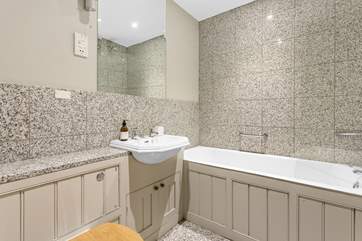 The family bathroom has both a shower and a bath, perfect for a long soak after a day of adventure.