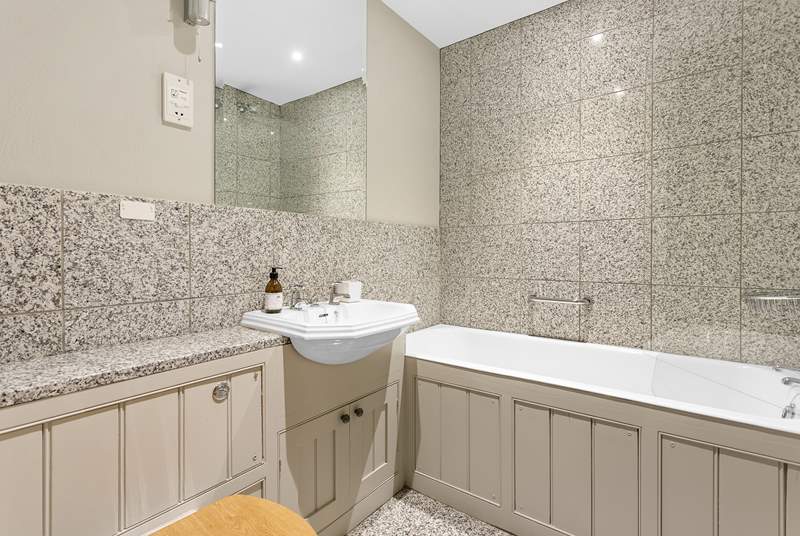 The family bathroom has both a shower and a bath, perfect for a long soak after a day of adventure.