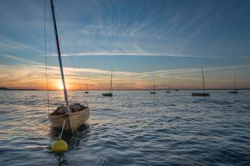 The end of a perfect day - watch the sun setting on those beautiful little harbour boats, memories of a perfect holiday.