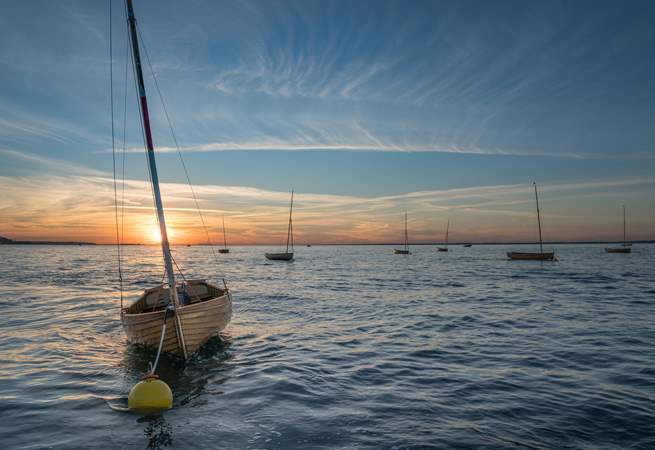 The end of a perfect day - watch the sun setting on those beautiful little harbour boats, memories of a perfect holiday.