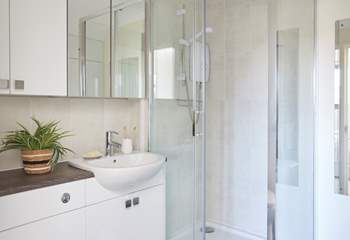 The en suite shower room which like the rest of the apartment is bright and airy