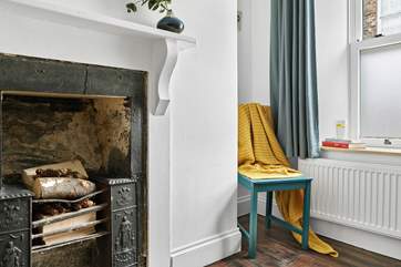 The fabulous ornamental fireplace is one of many original features in the cottage.