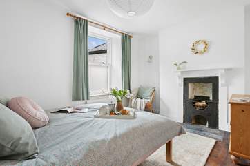 The second double bedroom also has an ornamental fireplace.