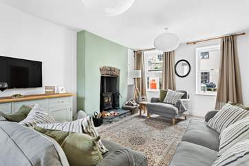 The sitting-room is beautifully furnished with comfort in mind.
