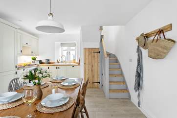 The kitchen/diner is perfectly fashioned and beautifully presented. The winding staircase leads to the first floor. Please note the staircase is steep.