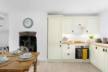 Sit at the table and chat with the chef whilst dinner is prepared.