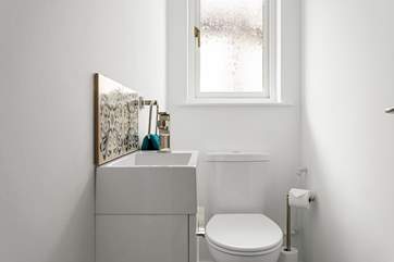 The cloakroom has a WC and wash-basin.
