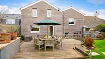 The outside area is a delight here, with a large deck for al fresco dining, a lawned area overlooking surrounding countryside to the sea, and a fabulous summer-house.