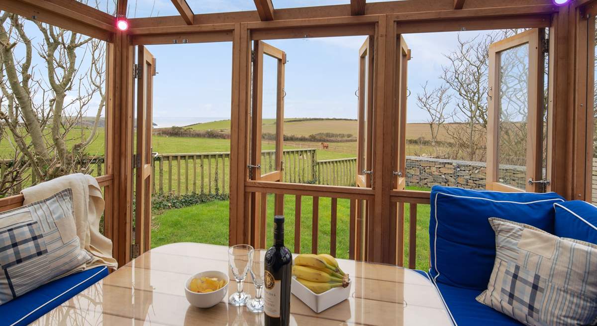 The fabulous summer house overlooks surrounding fields to the sea.