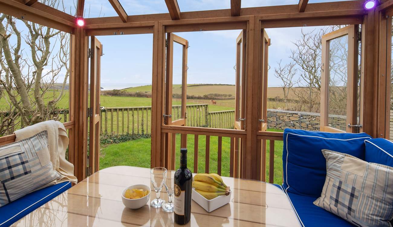 The fabulous summer house overlooks surrounding fields to the sea.