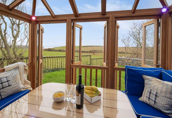 The fabulous summer house overlooks surrounding fields to the sea.