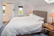 Bedroom 1 has a comfy king-size double bed and a dreamy outlook over the surrounding countryside to the sea.