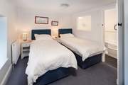 Bedroom 3 has three foot single beds, perfect for either children or adults.