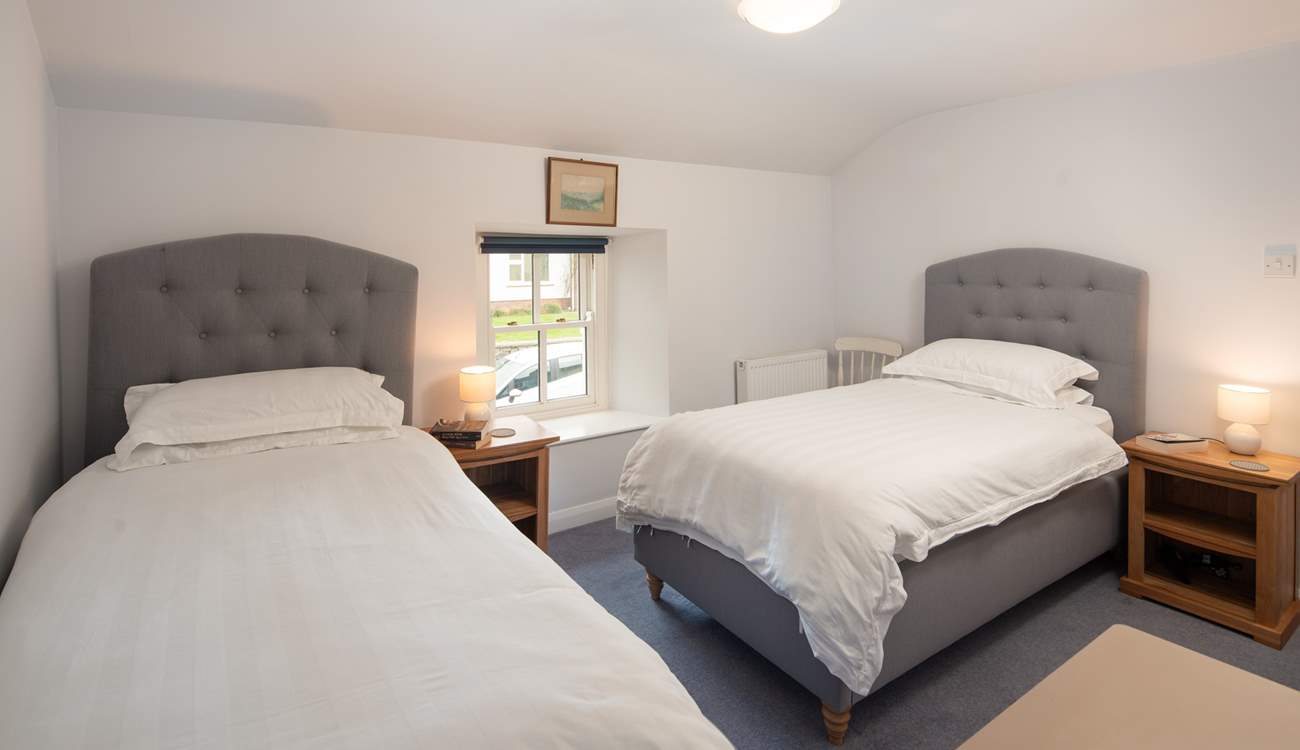 Bedroom 4 has two single beds.