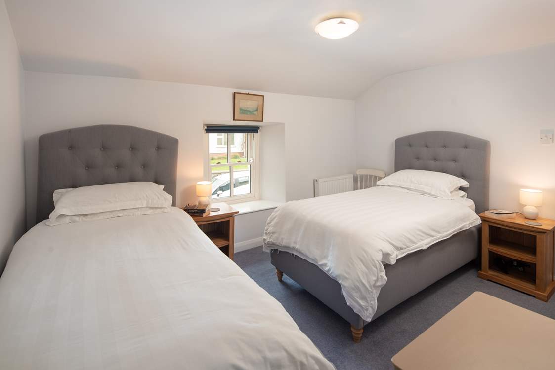 Bedroom 4 has two single beds.