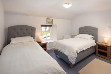 Bedroom 4 has two single beds.