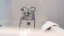 Bedroom 3 has an en suite bathroom, perfect for a long soak after a hard day on the beach.