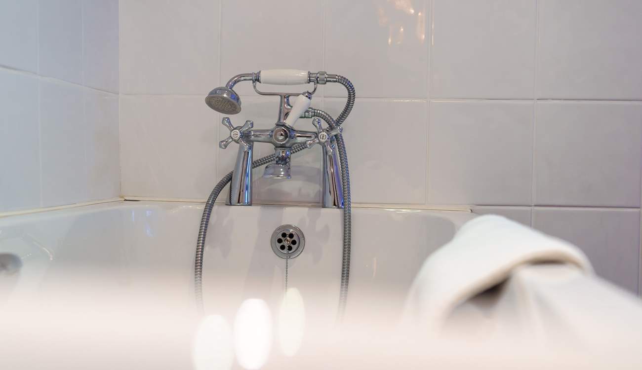 Bedroom 3 has an en suite bathroom, perfect for a long soak after a hard day on the beach.