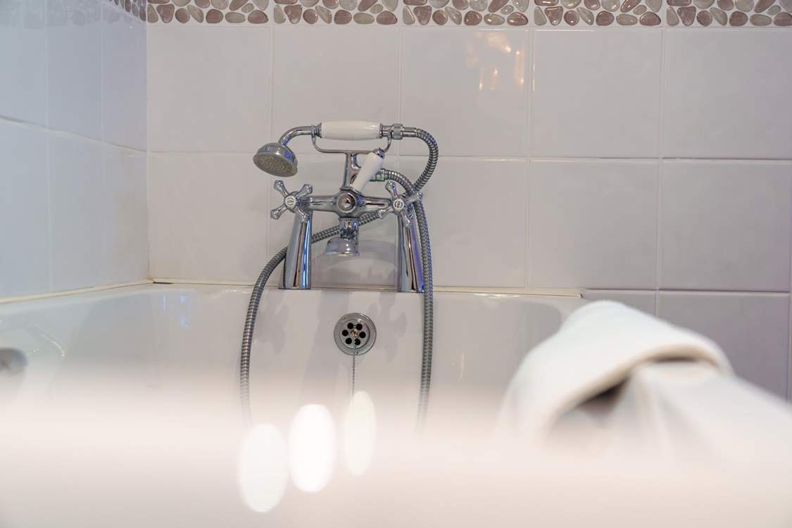 Bedroom 3 has an en suite bathroom, perfect for a long soak after a hard day on the beach.