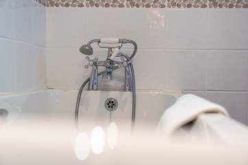 Bedroom 3 has an en suite bathroom, perfect for a long soak after a hard day on the beach.