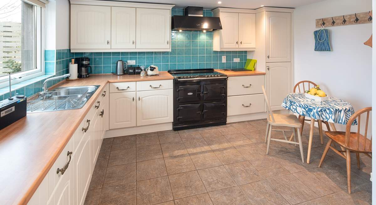 The spacious kitchen overlooks the large garden.