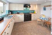 The spacious kitchen overlooks the large garden.