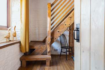 This cottage is full of imaginative, quirky details - like this beautiful staircase that leads to the en suite bathroom.