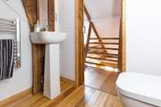 Just one of the interesting areas in this beautifully crafted property - the gorgeous en suite at the top of a wooden staircase.