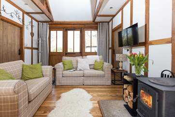 Cosy up on the comfy sofas and relax in the warm glow of the wood-burner.
