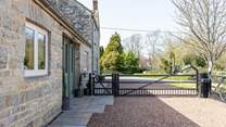 The gated driveway ensures privacy and secure parking. The neighbouring property is where the owners live.
