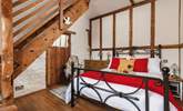 The gorgeous double bedroom is full of characterful woodwork; with a staircase leading to an attractive en suite. Be careful as you climb! - Thumbnail Image