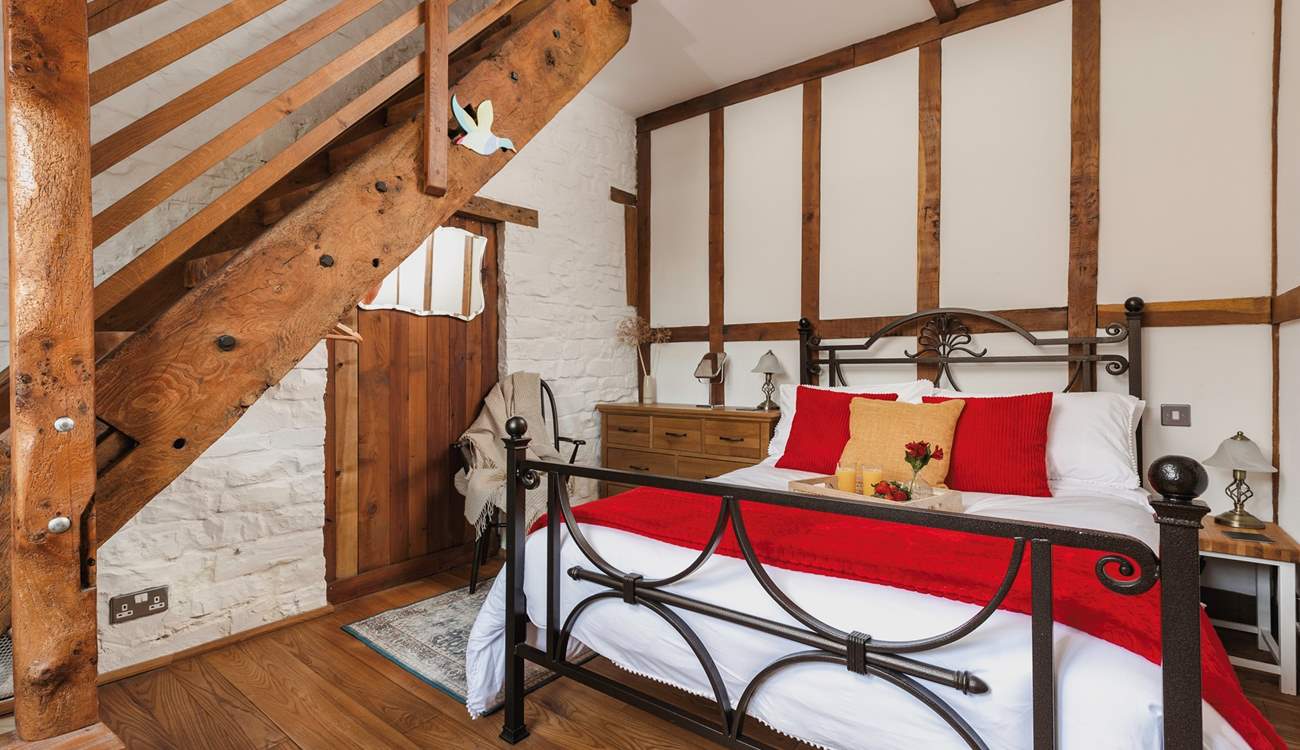 The gorgeous double bedroom is full of characterful woodwork; with a staircase leading to an attractive en suite. Be careful as you climb!