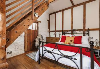 The gorgeous double bedroom is full of characterful woodwork; with a staircase leading to an attractive en suite. Be careful as you climb!