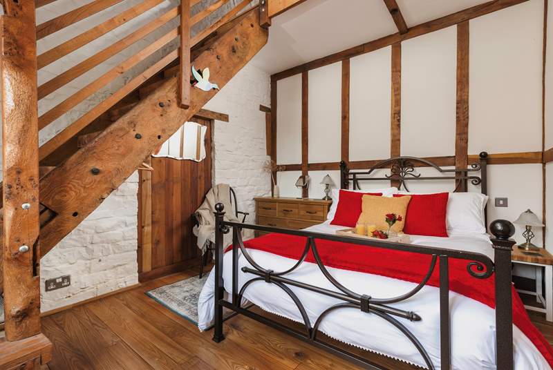 The gorgeous double bedroom is full of characterful woodwork; with a staircase leading to an attractive en suite. Be careful as you climb!