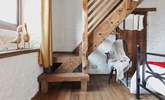 This cottage is full of imaginative, quirky details - like this beautiful staircase that leads to the en suite bathroom. - Thumbnail Image