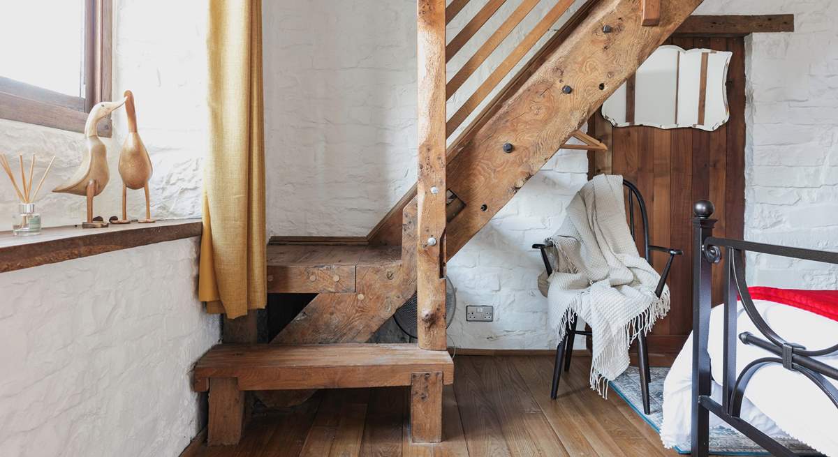 This cottage is full of imaginative, quirky details - like this beautiful staircase that leads to the en suite bathroom.