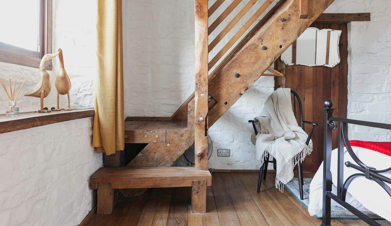 This cottage is full of imaginative, quirky details - like this beautiful staircase that leads to the en suite bathroom.