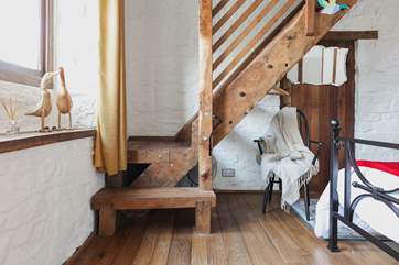 This cottage is full of imaginative, quirky details - like this beautiful staircase that leads to the en suite bathroom.