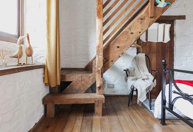 This cottage is full of imaginative, quirky details - like this beautiful staircase that leads to the en suite bathroom.