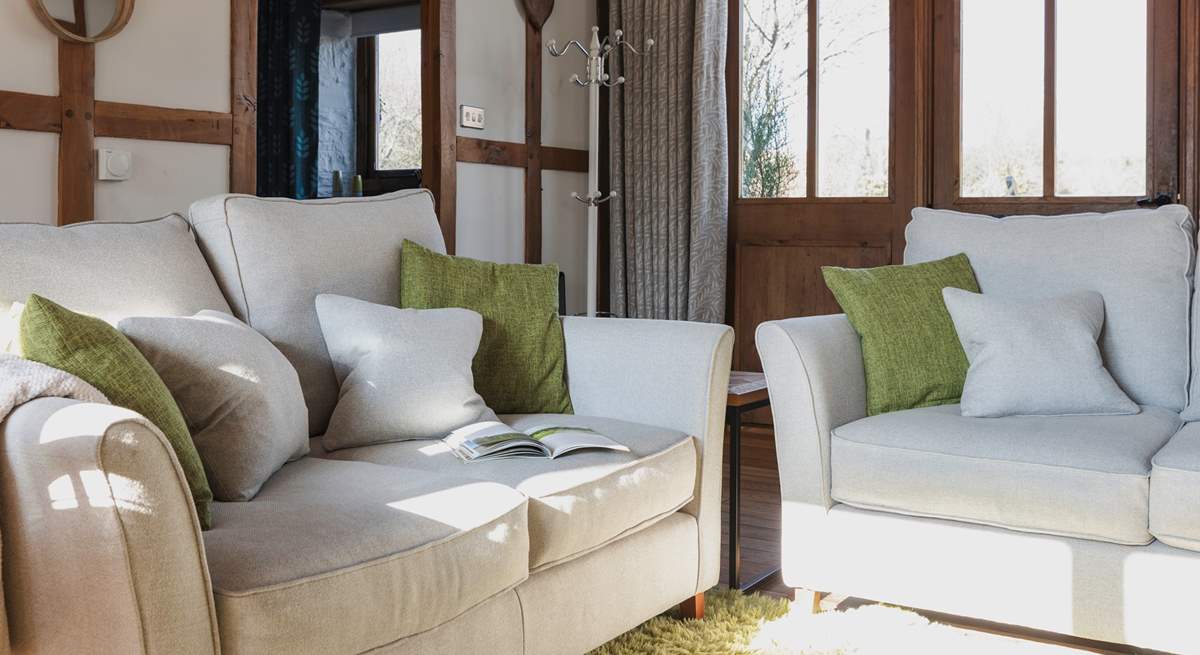 Cosy up on the comfy sofas and relax in the warm glow of the wood-burner.