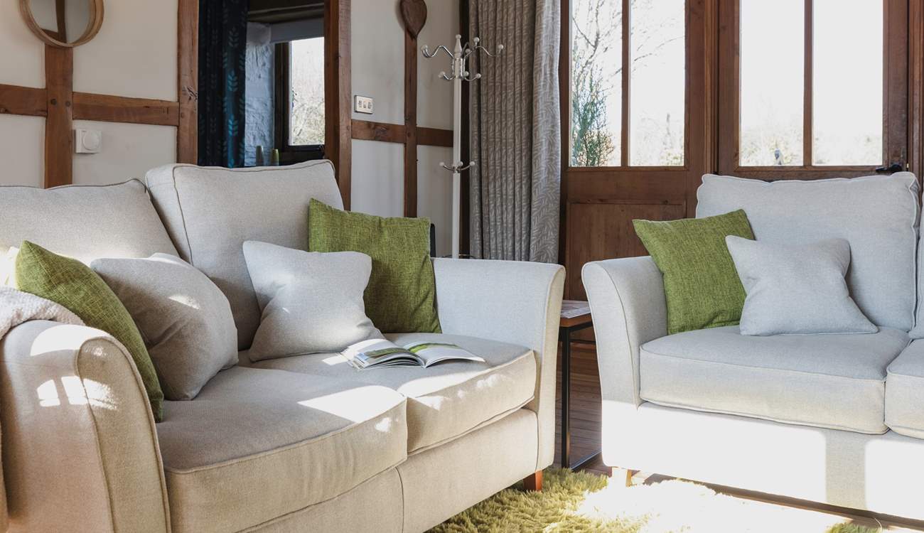 Cosy up on the comfy sofas and relax in the warm glow of the wood-burner.