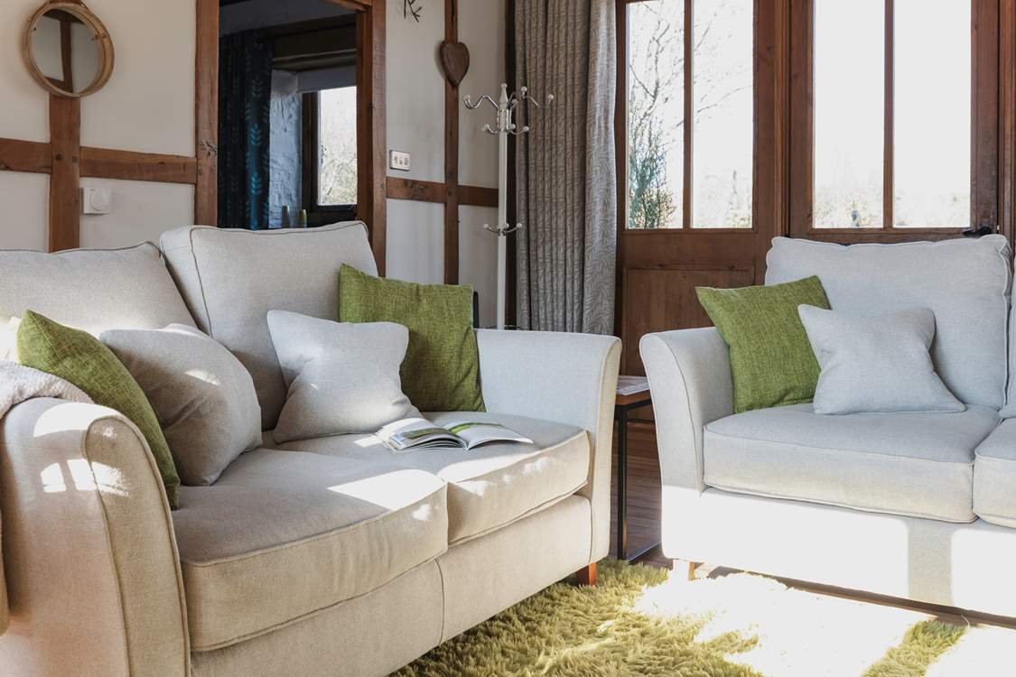 Cosy up on the comfy sofas and relax in the warm glow of the wood-burner.