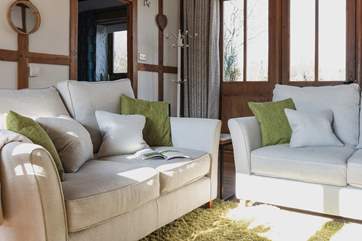 Cosy up on the comfy sofas and relax in the warm glow of the wood-burner.