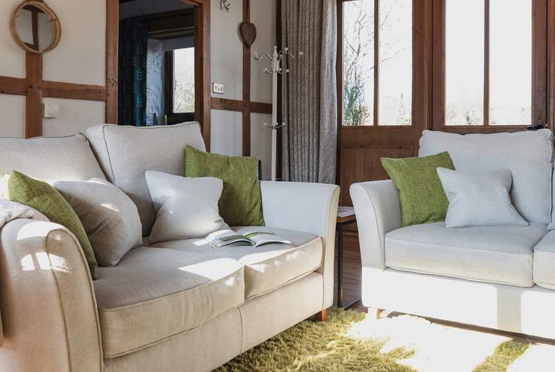 Cosy up on the comfy sofas and relax in the warm glow of the wood-burner.