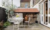 Enjoy a little al fresco summer dining, in your completely self-contained courtyard area. - Thumbnail Image