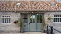 Welcome to Minstrels! With its charming rustic stonework and welcoming frontage. You can see the cream door leading to neighbouring The Smithy on the left.