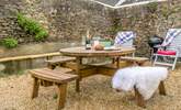 The secluded and sheltered garden lends itself perfectly to al fresco dining. - Thumbnail Image