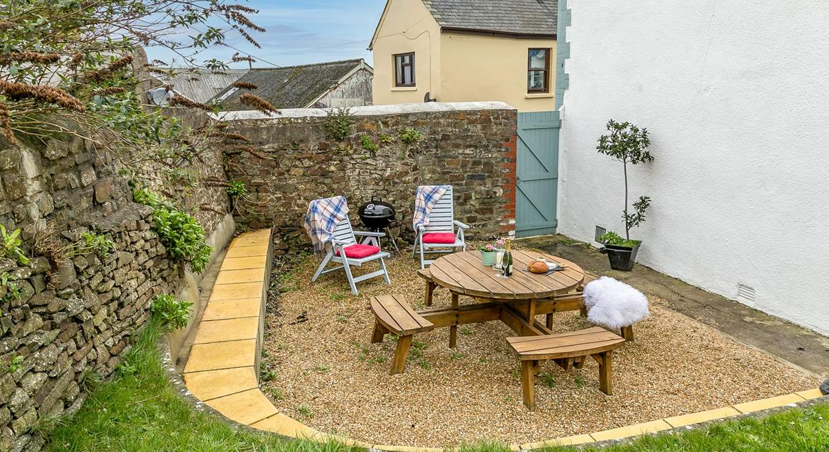 The sheltered outside garden area is perfect for a spot of al fresco dining.