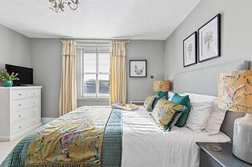 The double bedroom with king-size bed and luxury linens is exquisite.