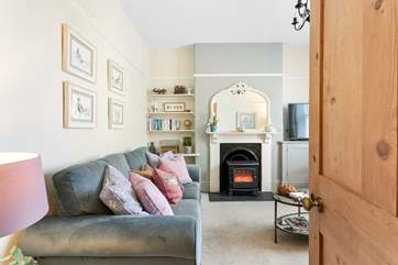 Tastefully furnished in pretty pastel tones, the sitting-room is gorgeous.
